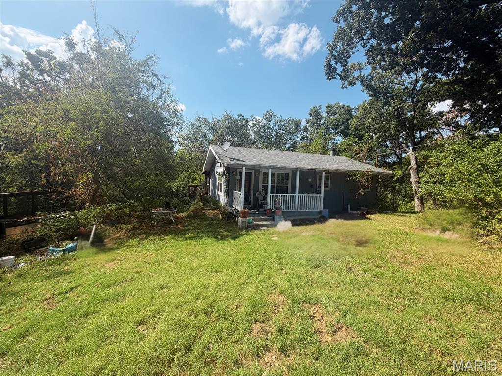 9 secluded acres in Barnhart! Very unique property with so much potential. 2 different parcels Tax ID: 09-9.0-31.0-3-001-001.01 & Tax ID: 09-9.0-31.0-3-001-001 are both included in the sale. On one parcel there is a 3 bed 2 bath home as well as a pad where there used to be a mobile home. The home has solid bones and would be a great renovation project. This parcel has a holding tank that goes to a lagoon per the owner. Second parcel has a rental property on it. Do not enter the property without a confirmed showing and do not disturb tenants. 2 bedrooms 1 bathroom. Currently rented on a verbal month to month agreement of $550/ month. There are two mobile homes on this parcel both are not considered as apart of the value. 3 total mobile home spaces. 4 separate septic tanks and drain fields per the owner. Rental house is connected to public water. Public water line tap ons available at each mobile home pad per owner. White House is an old well house with a holding tank. 4 red shacks on property are currently used for storage. This parcel currently has three driveway accesses to the property. Property to be sold as is. There are two total propane tanks one on each parcel both owned that will transfer with the sale of the property. 

7519 Mulberry Rd House details: 3 bedroom 2 bathroom home. updated electrical panel 200 amp. Roof installed in 2022. Vaulted/ beamed ceilings. full bathroom nearly finished in the basement. Rec area nearly done in the basement with a brick wood burning fireplace. Bonus room in the basement. Screened in deck overlooks a quiet secluded view.