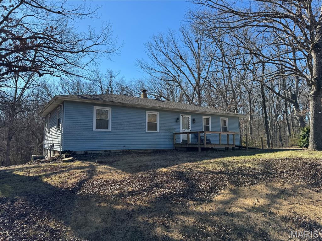 Set on nearly five acres of beautiful countryside, this property offers a rare chance to enjoy the space, privacy, and freedom that true country living provides. Tucked away in a quiet setting, the land invites endless possibilities, from gardens and animals to outdoor gatherings or simply enjoying wide open space and natural surroundings. Properties with this amount of land are becoming harder to find, especially at a price point that still allows a buyer to make it their own. The 4 bedroom home is selling as is and needs some love, but it offers a solid starting point for a buyer occupant looking to build equity over time or an investor.  A full basement with a half bath adds flexibility to improve, expand, or reimagine the space at your own pace. Whether you are looking for a peaceful place to settle in, a weekend retreat, or a long term investment, this acreage delivers a country setting that rarely comes available, with land, privacy, and opportunity at the center.