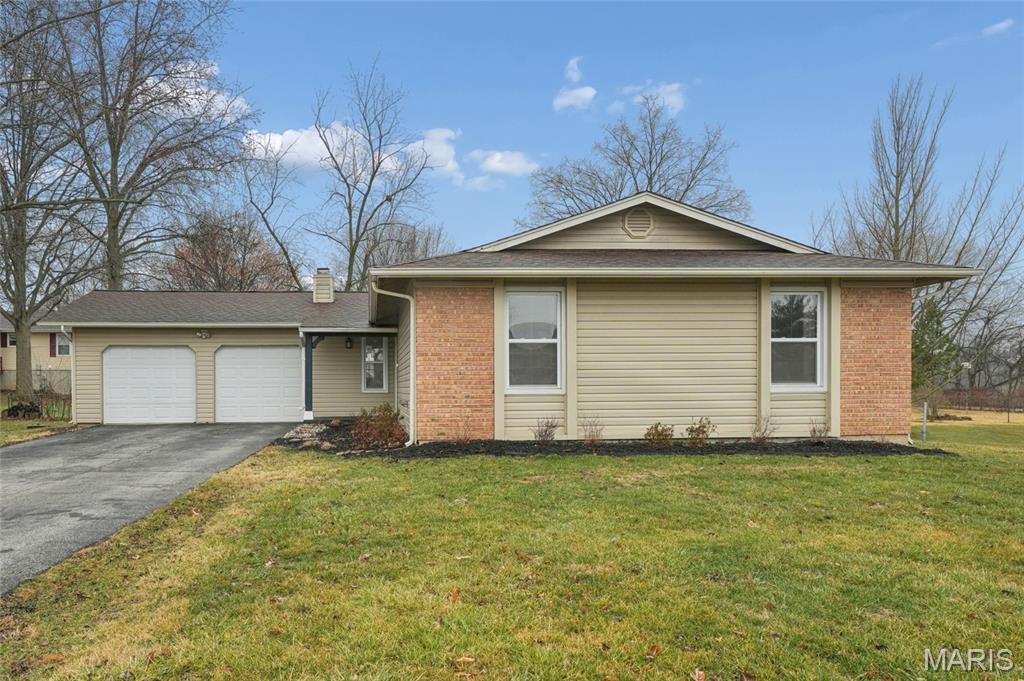 Welcome to this charming ranch home tucked away on a quiet cul-de-sac! This three bedroom, two bath home offers the perfect blend of character and functional living space. The large family room and dining room combo is perfect for hosting gatherings. Full of natural light, the kitchen is the ultimate spot for your morning routine. A gas range and built in microwave offer convenience while the stylish butcher block island provides a focal point for meal prep or a casual morning coffee. And a planning desk provides a workspace for daily organization. Adjoining the kitchen is a warm and inviting hearth room, centered around a classic wood-burning fireplace—the ultimate spot to curl up on a chilly evening. The primary suite is a true sanctuary, featuring a spacious bathroom with a double vanity to streamline your daily routine and ample storage in the walk-in closet. Two additional well-sized bedrooms share a second full bath. The unfinished lower level with a bathroom rough-in is a blank canvas for you to create additional living, office, play or sleeping space. Step outside to your fenced-in backyard, providing a secure space for pets, play or relaxing around the firepit. This home also features a clean and organized two car garage and a location that provides peace and quiet while staying close to all the amenities the St. Peters area has to offer. Welcome home!