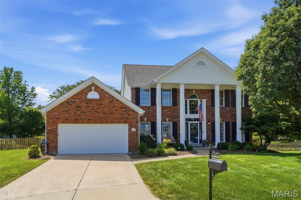 From the stunning two-story entry and updated kitchen to the inviting screened porch and finished lower level, this beautifully maintained Arbor Oaks home offers the ideal blend of timeless charm and modern updates on a cul-de-sac lot in one of Ballwin's most sought-after neighborhoods. A spacious 4-bedroom, 3.5-bath home designed for both everyday living and entertaining. Rich hardwood floors, abundant natural light, and thoughtful finishes create a warm and welcoming atmosphere throughout. The family room features custom built-ins and a striking floor-to-ceiling brick fireplace, while the updated kitchen showcases white cabinetry, solid surface countertops, stainless steel appliances, and a large center island that serves as the heart of the home. The impressive primary suite offers a beautifully renovated bath with dual adult height vanities, soaking tub, oversized shower, and generous closet space. The finished lower level provides additional living and recreation space great for gatherings, game nights, work-from-home needs, or a fitness area. Relax year-round in the screened porch overlooking the level backyard, ideal for outdoor enjoyment. Residents of Arbor Oaks enjoy neighborhood amenities including a community pool and scenic lake. Located in the award-winning Parkway School District with Oakbrook Elementary and Parkway South High School, this home combines an exceptional location, desirable amenities, and move-in-ready appeal. Don't miss this opportunity to own a truly special home in the heart of Ballwin.