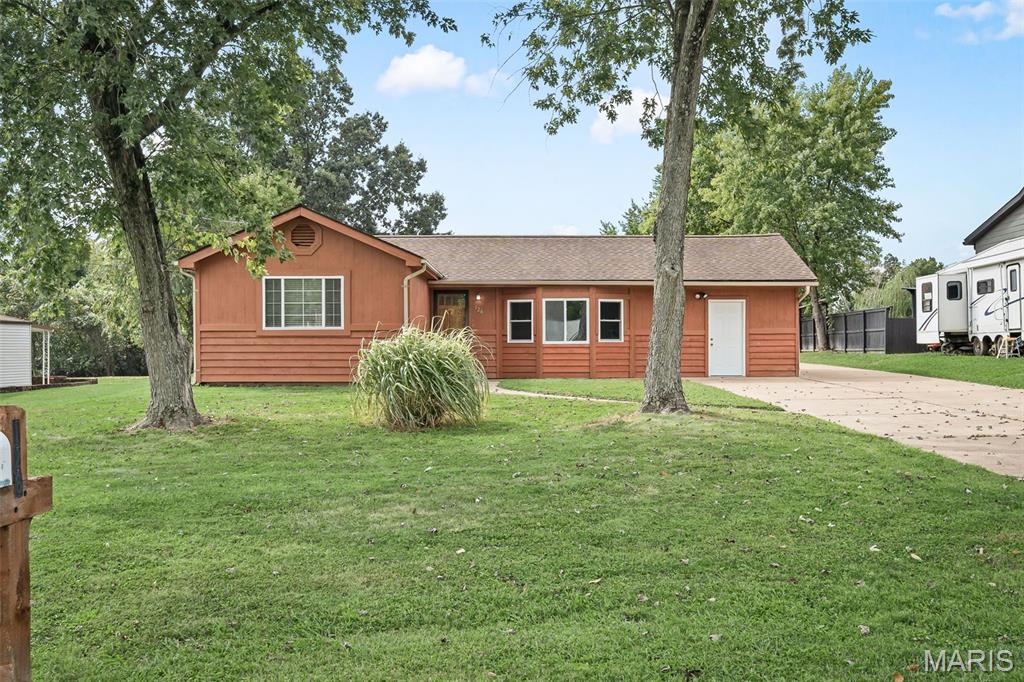 Looking for the quiet country feel close to city living, this is the one for you. 126 Cherry Hill Dr is a ranch home that sits on almost an acre and is located in Meadow Lark subdivision on a quiet dead end street within the Northwest R-1 School District. The expansive driveway leads you behind the home where you are greeted with a large covered deck on one side and a detached 3 car garage on the other. The deck is a perfect spot for morning coffee or afternoon cocktails while the detached oversized 3 car garage with AC and heat has an additional flex space and storage room, ideal for auto mechanics and offers tons of space for a workshop or extra space to entertain. The extended yard is perfect for gardening, yard games, bon fires, the possibilities are endless.  Inside the home you have 3 bedrooms and 1 full bath that is already equipped with some accessible features. Enjoy plenty of natural light in the main living area that comes with a TV and sound system at no monetary value to you. The kitchen provides plenty of storage and counterspace making it easy to prep for meals and everyday living. Just a couple steps down from the kitchen is the large utility room where you will find your laundry and access to your hot water tank, new furnace and well. This amazingly maintained home is waiting for you to make it your own! The refrigerator washer and dryer to stay with the home, sellers prefer to sell the home As-Is.