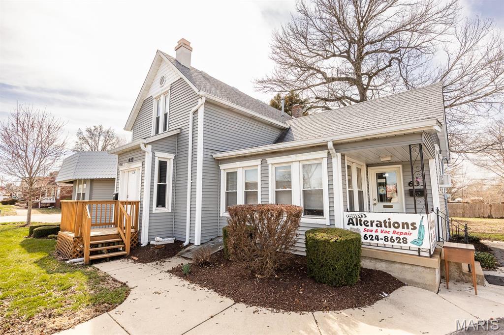 Prime corner lot on South Lincoln, offering high-traffic exposure in O'Fallon, IL. This property features two buildings with multiple income-generating opportunities, ideal investors. The main building (633-635) includes two ground-floor commercial spaces: a long-standing alterations/seamstress business ($700/month) and a larger office/retail space that currently is leased to a mental health professional ($1,000/month + $200 for utilities graduating $100/month each of the next two years). The second-floor space, accessible via a separate entrance at 102 W. 7th, was formerly a residential apartment and offers additional value-add potential if renovated and brought up to code. Across the paved parking lot, the second building (625) houses a hair salon generating $585/month. The interior photos included are of the main floor, larger space. Don't miss out on this versatile property with great income potential. Contact us today for more details or to schedule a showing!

Call us today to schedule a showing!