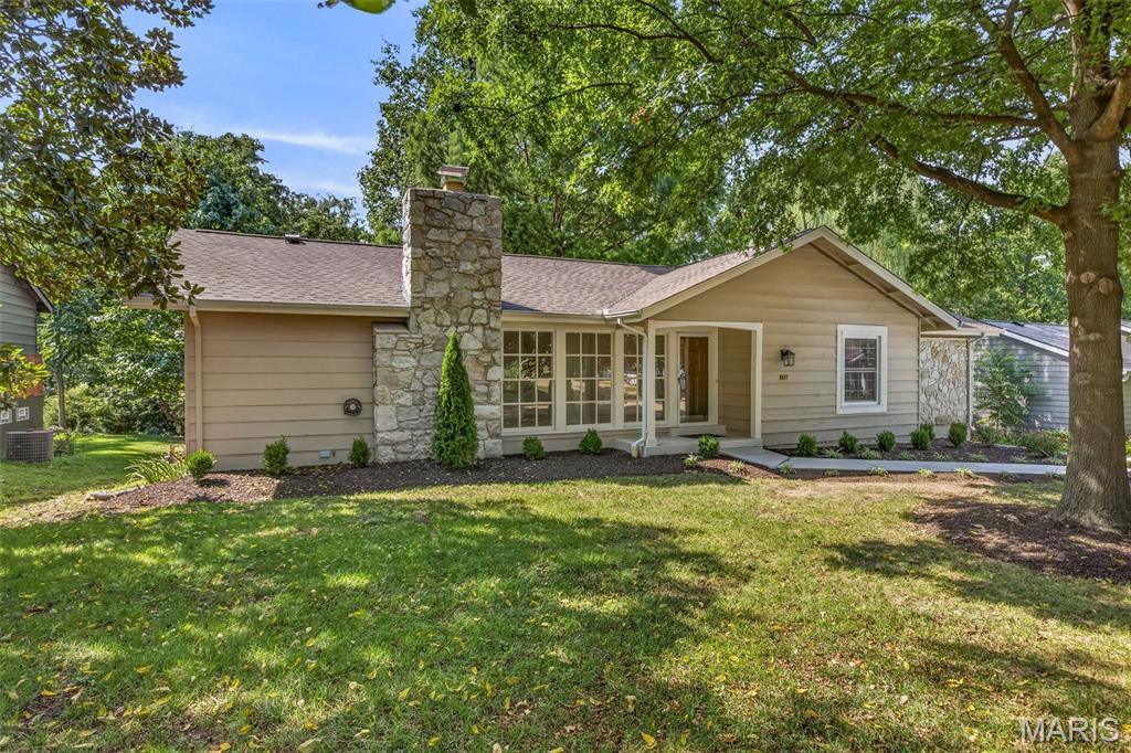 Welcome to this beautifully renovated 3-bedroom, 2-bath ranch in a sought-after Manchester neighborhood! Thoughtfully updated from top to bottom, this bright and open home offers the feel of new construction with the charm and established setting of a mature neighborhood. The extensive renovation includes a new roof, LeafFilter gutter protection, fresh interior and exterior paint, updated electrical outlets, switches and light fixtures inside and out, new plumbing drains and fixtures up to main stack, most all windows new, new flooring throughout, new doors, trim and hardware, professional landscaping, brand-new concrete driveway and sidewalk, and new garage doors with openers. The inviting main level features a spacious living room with a striking stone wood-burning fireplace, a generous dining area, and a beautifully appointed kitchen with custom cabinetry, breakfast bar, solid-surface countertops and stainless-steel appliances, including the refrigerator. The luxurious primary suite features a stunning custom-tiled shower and thoughtfully designed finishes. The finished lower level offers exceptional flexibility with a spacious recreation area perfect for a family room, home theater, game room, or private retreat. The walkout basement provides convenient access to the outdoors and plenty of natural light. Enjoy relaxing or entertaining on the large deck overlooking a private, wooded and level lot. The oversized two-car garage provides abundant parking and storage. From the extensive updates to the beautiful setting and flexible living spaces, this exceptional Manchester ranch offers an incredible combination of quality, comfort and style. Conveniently located near shopping, dining, parks, recreation, and everyday amenities Manchester/Ballwin has to offer!