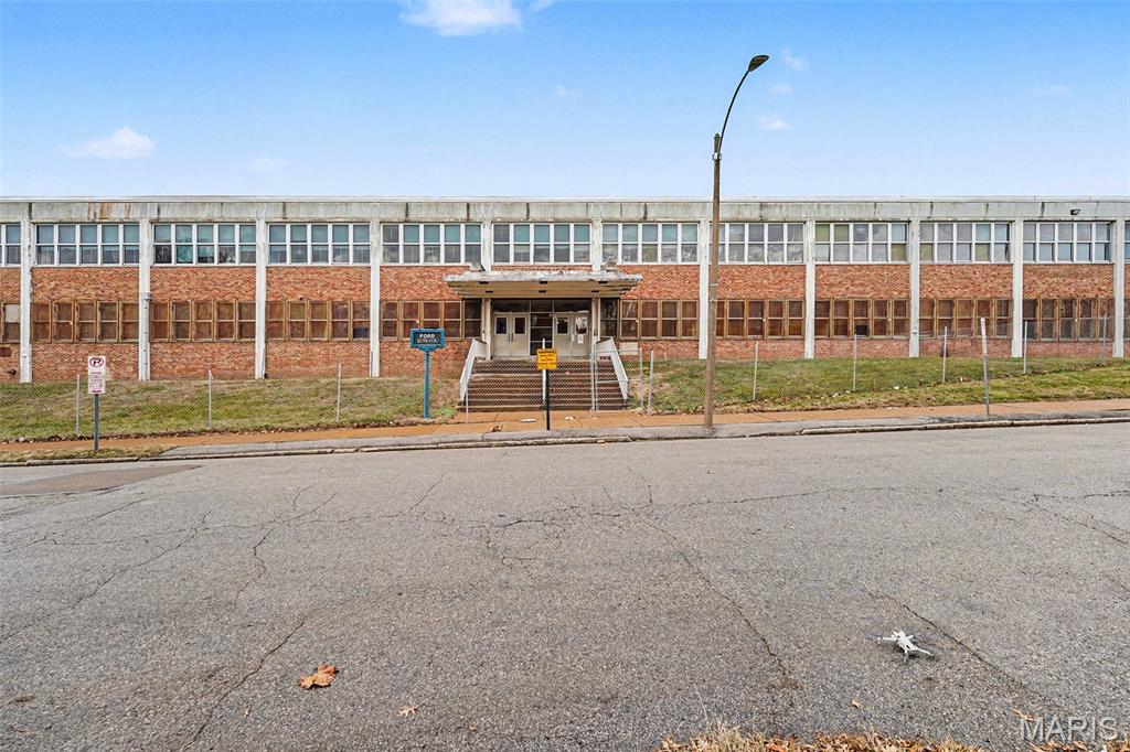 Ford School presents a compelling opportunity to acquire a large institutional property located within an Opportunity Zone in the City of St. Louis. Formerly operated as a private school, the property consists of approximately 65,880 square feet situated on a 3.87-acre site, offering a substantial building footprint with significant excess land. The two-story structure provides a flexible layout suitable for continued educational use or adaptive reuse, including community, institutional, or commercial applications, subject to zoning and municipal approvals. Zoned B, the property supports a wide range of potential uses and is well positioned within the St. Louis City submarket with convenient access to surrounding neighborhoods and major corridors.
The expansive site allows for parking, outdoor programming, campus-style operations, or future redevelopment, making it attractive to charter schools, nonprofits, churches, community organizations, or investors seeking scale and long-term upside. Its Opportunity Zone designation further enhances its appeal for redevelopment-focused buyers. This offering represents a rare chance to reposition a legacy school facility with strong land value and redevelopment potential in an established urban location. SLPS