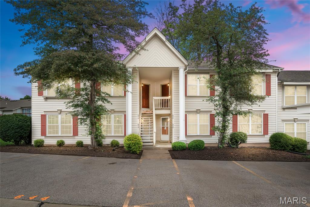 Welcome home to 644 Sugar Trail Court, a beautifully maintained ground-floor condominium in the sought-after Sugarwood community of St. Peters, Missouri. This 2-bedroom, 1-bathroom residence offers 852 square feet of comfortable, move-in-ready living space designed for the buyer who wants the benefits of homeownership without the hassle of exterior upkeep. Whether you are a first-time buyer or a downsizer seeking simplified living, this property delivers on every level.
Step inside to find a bright, open floor plan designed for everyday living and entertaining alike. The living room is generously sized with fresh neutral-toned walls and professionally cleaned plush carpeting. A large sliding glass door bathes the room in natural light while opening directly to the lush green common area behind the building — a peaceful spot for morning coffee, outdoor relaxation, or convenient access for pets. As a ground-floor unit, you step right outside without navigating a single stair.
The kitchen is both functional and attractive, anchored by a pass-through breakfast bar that keeps the floor plan open and connected. Solid wood cabinetry with updated hardware pairs beautifully with rich dark countertops, while durable tile flooring carries through the kitchen and entry hallway. The updated stainless steel appliance package — featuring a new range (2022), new built-in microwave (2024), and new dishwasher (2023),  — means you can move right in without worrying about costly replacements down the road.
Both bedrooms are comfortably proportioned with large windows that invite natural light, ceiling fans for year-round comfort, and ample closet space. The flexible second bedroom adapts easily as a home office, nursery, or guest room depending on your needs. 
The Sugarwood Condominium HOA delivers outstanding value at just $321 per month, covering water, sewer, trash removal, exterior building maintenance, lawn care, snow removal, and building insurance. Residents also enjoy full access to a sparkling community swimming pool. This all-inclusive coverage is especially valuable for first-time homeowners navigating the true costs of ownership for the first time. When you price out those utilities and amenities separately, the monthly value here is genuinely hard to beat.