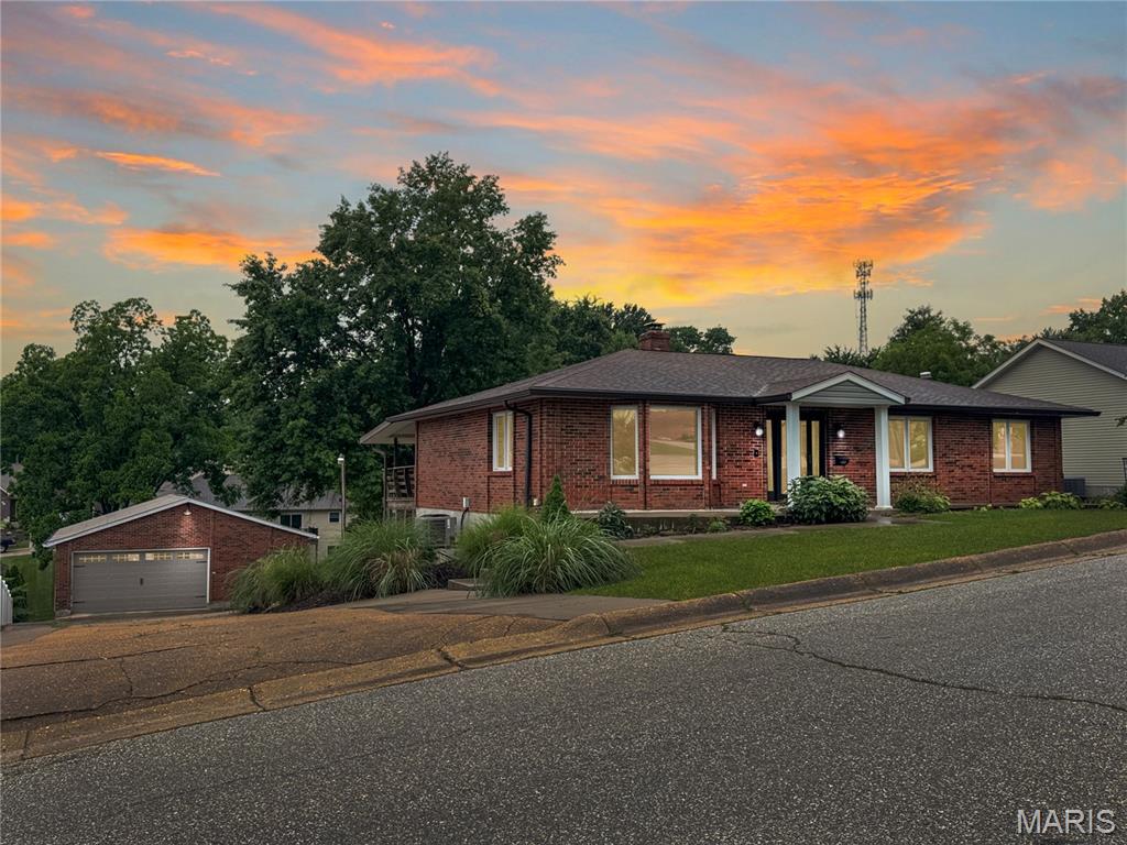 Exceptional Updated Full-Brick Ranch with Spacious Living & Fantastic Outdoor Areas! This exceptional ranch home offers the perfect combination of updates, space, and convenience. Situated on a large lot with beautiful landscaping, this rare find is move-in ready and waiting for its next owner. Step inside to a welcoming entry foyer that leads to a spacious, bright living room. The kitchen comes complete with appliances and opens to the dining area, creating a comfortable space for everyday living and entertaining. A door from the dining area leads to a huge covered deck overlooking the beautiful backyard. The main level features a private primary suite with its own bath, plus two additional bedrooms and a full hall bath. The finished walk-out lower level provides even more living space, including a large 28' x 13' family room with a gas fireplace, a fourth bedroom, full bath, office, utility room with washer/dryer hookups, and a three-season room. Step outside to the patio below, covered by the deck above, for additional outdoor enjoyment. Additional highlights include a detached 28' x 34' garage with opener, a man door, and an additional lean-to for lawn equipment. There is plenty of room both inside and out. Don't miss this opportunity to own a spacious, updated ranch in a convenient location. Schedule your showing today!