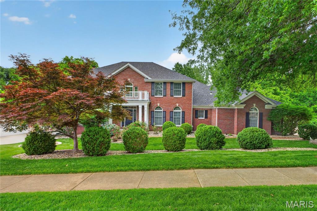 Elegant and thoughtfully designed, this exceptional home blends timeless architecture with inviting spaces for both entertaining and everyday living. A dramatic two-story foyer with marble flooring creates a memorable first impression, opening to gracious formal living and dining rooms. The great room is warm and inviting, featuring a fireplace, custom built-ins, wet bar, and a bay window overlooking the private backyard.
The beautifully appointed eat-in kitchen offers abundant cabinetry, generous prep space, and an effortless flow into the breakfast room. Surrounded by windows, the breakfast area captures peaceful views of the deck and wooded setting. 
Upstairs, the spacious primary suite with tray ceiling, dual walk-in closets with custom organizers, and a spa-like bath featuring double vanities, a Jacuzzi tub, separate shower, and private water closet. Three additional bedrooms provide comfortable accommodations, including a Jack-and-Jill bath and a private en suite.
Designed with entertaining in mind, the finished walk-out lower level offers exceptional gathering space with a media area, fireplace, custom built-ins, and an illuminated glass-block wet bar. A fifth bedroom, full bath, and extensive storage add flexibility for guests, recreation, or work-from-home needs.
Outdoor living is equally impressive with a low-maintenance deck overlooking the beautifully landscaped yard and serene wooded backdrop. Completing the home is an oversized garage ideal for the automotive enthusiast, featuring epoxy floors, finished walls, built-in cabinetry, and a dedicated workspace.