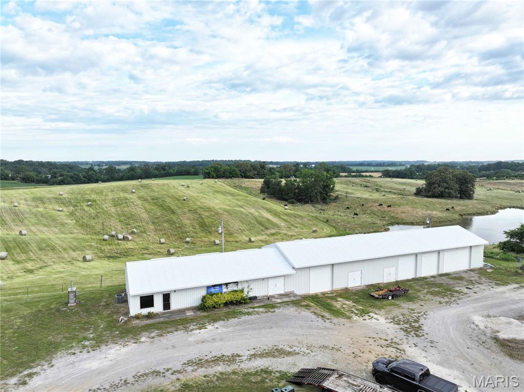 **Versatile Commercial Opportunity in Frohna, Missouri**

Unlock the potential of this well-positioned commercial property in the heart of Frohna. Offering approximately 2,880 square feet of functional space, this versatile building is well-suited for a variety of business, workshop, retail, storage, or investment uses.

The property features a dedicated storefront and office area that provides a professional space to welcome customers and conduct business. Connected to the showroom is a spacious workshop designed for productivity, complete with durable metal-lined walls and ceilings that are built to withstand demanding work environments.

Three overhead doors provide convenient access for equipment, inventory, and materials, while a separate double-door entrance makes it easy to move larger projects in and out of the building. Zoned heating and cooling throughout the office and workshop areas help maintain comfort and efficiency year-round.

Additional amenities include a centrally located kitchenette and restroom that conveniently serve both the showroom and workshop areas. A loft provides valuable extra storage space, maximizing the building's functionality.

For investors, the property's layout offers the potential to convert the building into storage units with minimal modifications, creating an opportunity for future rental income.

Whether you're looking to establish a new business location, expand your operations, create a workshop, or invest in an income-producing property, this flexible commercial building offers endless possibilities in a convenient small-town setting.

Schedule your showing today and discover how this property can work for you.