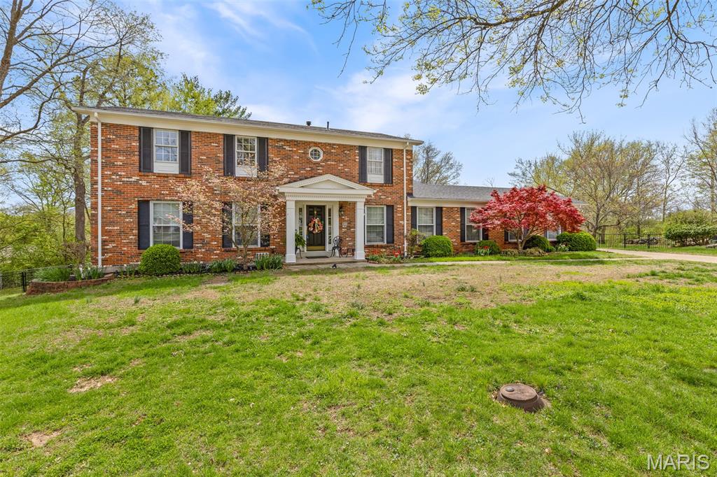Outstanding opportunity in a charming South County neighborhood! This well-maintained full brick 2-story home offers space, flexibility, and incredible potential with 5 generously sized bedrooms, 3.5 baths, and an oversized 3-car rear-entry garage and backs to Quail Creek Golf Course!
The main level features an updated kitchen with solid surface countertops, stainless steel appliances, breakfast room, and formal dining—perfect for both everyday living and entertaining. A huge laundry room adds convenience right off the kitchen. The large formal living room just off the entry provides flexible space and could be converted into a main-floor primary suite if desired.
The inviting great room offers a low maintenance gas fireplace, abundant natural light, double doors leading to the back with view of the golf course; ready for new homeowners to build the deck you truly desire (currently no deck is there)! 
Upstairs, you’ll find a spacious primary suite along with four additional bedrooms and full bath. The partially finished walk-out lower level includes a large family room, full bath, multiple storage areas, and a dedicated workshop—ideal for hobbies or extra functionality.
Meticulously maintained and full of potential, this home is ready for its next owners to move in and make it their own!