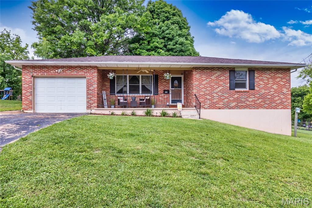 Showings begin 5/15. Welcome to this charming, mostly brick home offering the perfect blend of move-in-ready comfort and future potential. Featuring 3 bedrooms, 1.5 baths, and 1,222 total sq. ft., this home is designed for both everyday living and room to grow. Step inside to find a bright, semi-open main floor with beautiful laminate and luxury vinyl plank flooring flowing seamlessly throughout. The spacious kitchen is a true centerpiece, complete with ample cabinetry, generous counter space, a pantry, and a breakfast bar—offering added versatility with plenty of space for buffet-style entertaining and busy mornings alike. The main level also features a remodeled full bathroom with a double bowl vanity, plus two generously sized bedrooms. Downstairs, the walkout lower level already includes a third bedroom and half bath, with additional space ready to be finished—offering a fantastic opportunity to expand your living area and build equity. Enjoy peace of mind with a newer heat pump system and water heater. Outside, the expansive backyard provides plenty of room for entertaining, gardening, or simply relaxing. Located within walking distance to Melkus Park, where you can enjoy pickleball and basketball courts, this home truly has it all—comfort, convenience, and potential! The seller prefers to sell As-Is as a convenience to the seller. This home has already passed DeSoto's municipal occupancy inspection. Don’t miss your chance to make this one yours!