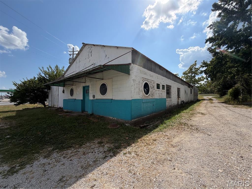 6,000 Sq. Ft. COMMERCIAL BUILDING WITH HIGHWAY FRONTAGE-ZONED M1!!! Excellent opportunity for a commercial, manufacturing, warehouse, fabrication, automotive, or industrial operation. This 6,000 sq. ft. building offers outstanding visibility with highway road frontage, high traffic counts, and easy-to-see exposure, providing a strong location for both business operations and customer access. The 120' x 50' building features 14-foot ceilings and a substantial cinder block and steel foundation combo, providing a solid structure for a variety of commercial uses. The property is equipped with 3-phase 600-volt electrical service along with single-phase electric, making it well suited for equipment-intensive operations. A major highlight is the 10-ton bridge crane, featuring approximately 12 feet of clearance, a 30-foot-wide span, and a 60-foot track, offering valuable functionality for material handling, fabrication, manufacturing, automotive, and industrial applications. With its combination of highway visibility, generous interior space, high-capacity electrical service, crane infrastructure, and versatile layout, this property presents an excellent opportunity for an owner-user or investor seeking a functional commercial/industrial facility with significant potential.