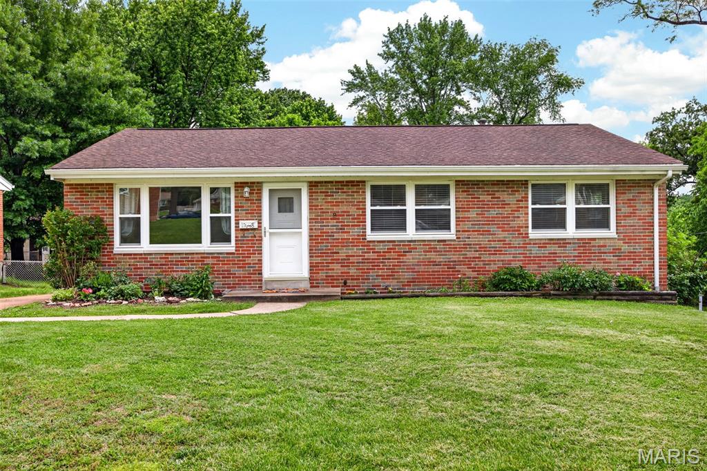Tucked away in a quiet, family-friendly neighborhood within the highly sought-after Pattonville School District, this beautifully maintained home offers the perfect blend of comfort, style, and thoughtful updates. Featuring 3 bedrooms, 2 bathrooms, and an additional sleeping area in the partially finished lower level, this home provides flexible living space designed for today’s lifestyle. Step inside to discover gleaming hardwood floors throughout, complemented by luxury vinyl tile in the kitchen and fresh, modern paint tones that create a warm and inviting atmosphere. The kitchen is equipped with black appliances, including a brand-new gas range, making it as functional as it is stylish. Major improvements such as a newer electrical panel, plumbing, and windows offer peace of mind for years to come. Outside, enjoy a covered back patio overlooking the fully fenced yard making it an ideal setting for entertaining, relaxing, pets, or play. A long driveway provides ample parking for guests and everyday convenience. This move-in ready gem combines timeless charm, modern updates, and an unbeatable location in one exceptional package.