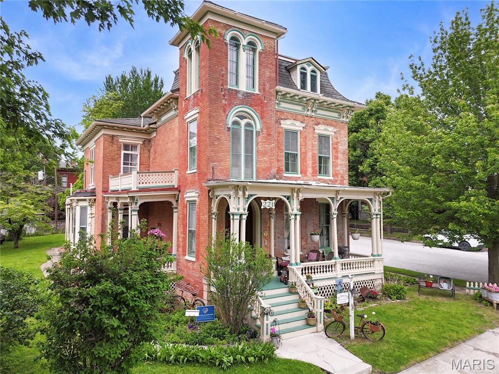 Step into a rare opportunity to own a true piece of Hannibal history with the iconic Dubach Inn—an elegant Italianate villa originally constructed in 1871 and offering nearly 5,000 square feet of finished living space. With the next owner becoming just the fifth owner in its 155 year history- The Dubach Inn represents a level of preservation and legacy that is rarely available. Ideally located just three blocks from Main Street in Hannibal’s historic downtown, the home blends timeless architectural character with modern comfort and exceptional income-producing potential.
Currently operating as a successful bed and breakfast for 18 years, the property is designed with multiple private suite-style living spaces, each offering its own bedroom, sitting area, and bath—creating a layout that naturally supports a variety of uses. Two of the rear suites feature private exterior access, enhancing flexibility for short-term rentals, extended stays, or separate tenant use.
The property is being sold fully furnished, allowing for a seamless transition for the next owner—whether continuing operations, launching a short-term rental business, or simply moving in and enjoying the space immediately. The nearly 5,000 square foot layout allows for a wide range of configurations, including owner-occupied living with separate rental spaces, group accommodations, or long-term housing options.
Whether you choose to operate as a turnkey hospitality business, live in the home full-time while generating supplemental income, or convert the property into a high-performing short-term or multi-unit investment, the flexibility here is unmatched. Positioned in a tourism-driven market with steady visitors and returning guests, this property offers the rare combination of historic charm, prime location, and multiple income pathways—making the Dubach Inn both a legacy property and a forward-looking investment.