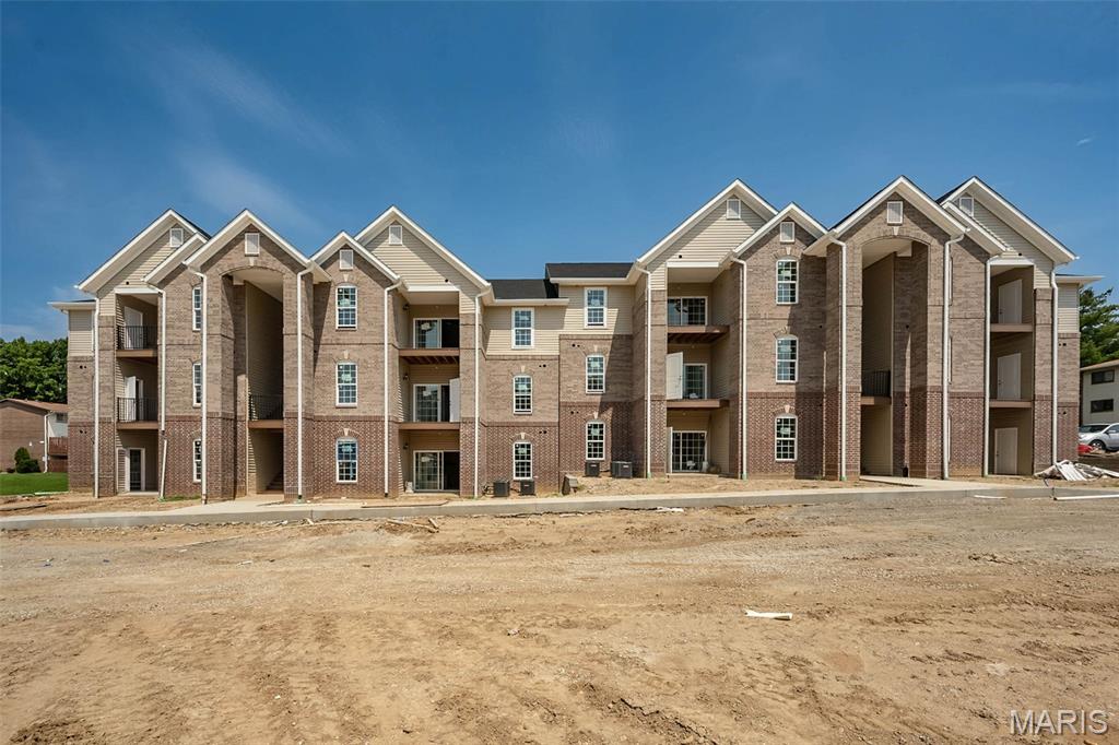 Brand new and ready to impress! A rare opportunity for new construction in an established Ellisville location, these newly built 2-bedroom, 2-bath condominiums at Carmel Woods offer fresh, modern living without sacrificing the convenience of an established area. With only four units currently available in the newly constructed building, now is the time to take a closer look!

Designed for the way you live today, the spacious open-concept layout brings the kitchen, dining and living areas together beautifully, creating an easy flow for everyday living and entertaining. Contemporary finishes, abundant natural light and private outdoor living add to the fresh, modern feel, while two bedrooms and 2 baths provide flexibility for guests, a home office or your own private retreat. In-unit laundry, covered parking and a low monthly HOA fee make everyday living even easier. Each unit offers 1 assigned and 1 unassigned parking spot.

And the location is hard to beat! Tucked just off the Manchester Road corridor, Carmel Woods puts shopping, dining, recreation and everyday essentials within easy reach while offering convenient access throughout West County.

Everything is fresh. Everything is new. And with just four units currently available, opportunities are limited. Come tour the beautifully furnished display and see what brand-new condo living at Carmel Woods has to offer!

Photos shown are of the furnished display unit and are intended to showcase the design and finishes available. Display unit is not for sale; features and finishes may vary by unit. Photos of Bluebird Park close by!