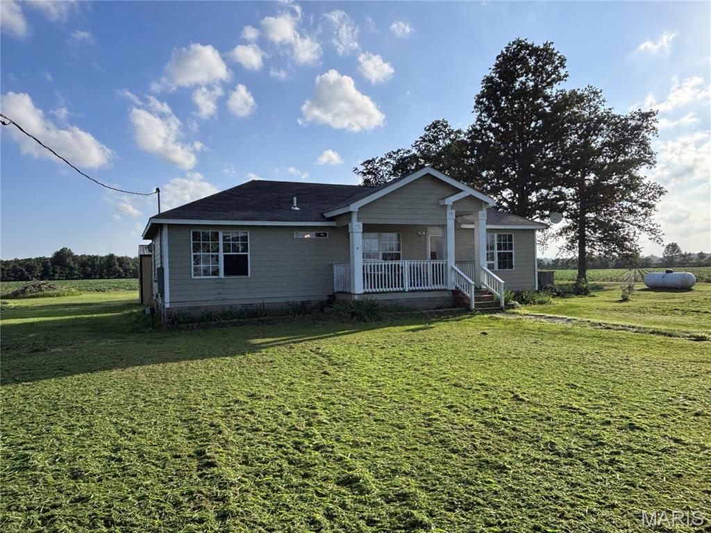 You won't want to miss the opportunity to call this peaceful property Home! The beautiful & functional 1.5 acre property sits on Highway 53 & is just a hop, skip & a jump away from Town. The property offers a nice long driveway perfect for those care enthusiasts that are in need of extra parking or those that prefer to sit & watch the world go by on this fantastic porch that's perfect for Morning Coffee or Afternoon Tea! The inside of the Home offers a good-sized Master with an attached full Bathroom as well as 2 extra Bedrooms & Bathroom in the Hallway. The Living Room/Eat-in-Kitchen is perfect for entertaining Family during those big Holiday celebrations. In the Backyard you'll find a very nice Storage Shed that was once converted into a "She Shed" hangout equipped with a Bar that was perfect for Summer Afternoons hanging by the Pool. However you choose to enjoy this property, I'm sure it'll be amazing because it'll be your own!