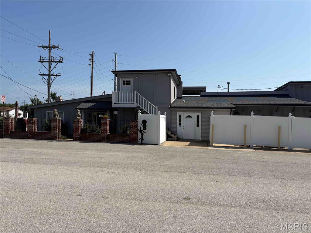 5,200 sq ft office warehouse with one apartment located on the first floor and another apartment located on the second floor all on one parcel of land known as 8915 S. Broadway.  The two apartments are vacant but owner was collecting $700 & $400 per month when they were both rented out.  There is additional storage warehouse space on the second floor of the warehouse. 

Also included with this sale is 9005 S. Broadway being a fenced in vacant storage yard lot collecting $400 per month, 9007 S. & 9009 S Broadway is a residential rental house and an additional vacant lot collecting $875 per month, 103 Kayser is a storage lot collecting $200 per month and 111 Kayser is a storage lot with a small garage collecting $300 per month.  The total acreage for all parcels is 1.2 Acres. The property is zoned Residential and its current industrial use is a non-conforming use grandfathered in.