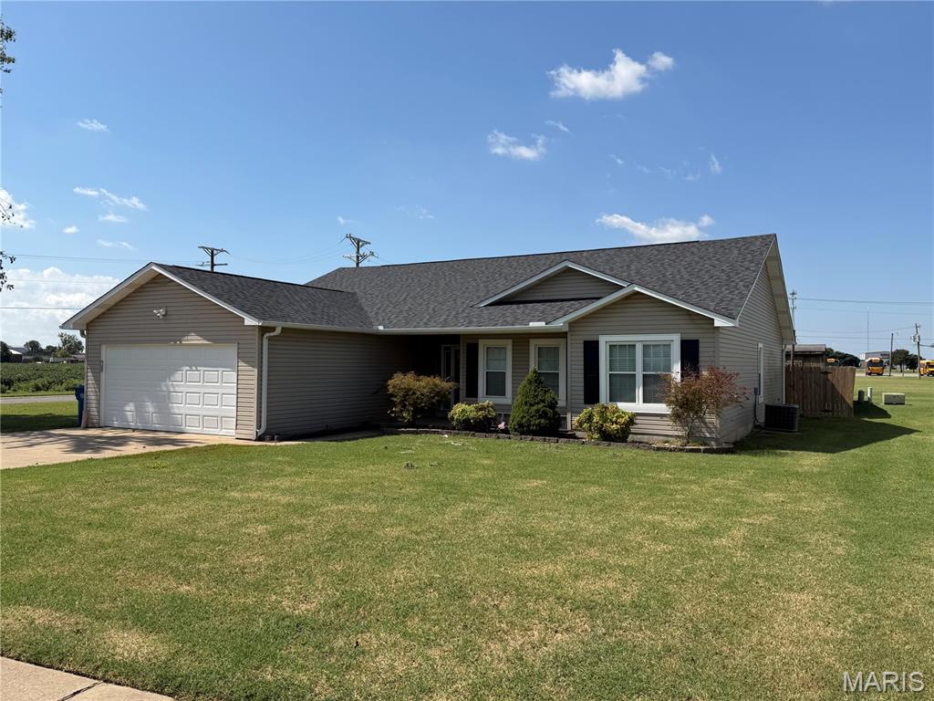 Welcome to 1102 Sequoyah Avenue in New Madrid! This spacious 3-bedroom, 2-bath home offers approximately 1,795 square feet of living space with an open floor plan and plenty of room both inside and out.

Step inside to an inviting open-concept kitchen, dining, and living area highlighted by a vaulted ceiling, recessed lighting, and an abundance of space for everyday living and entertaining. The kitchen features ample cabinetry and a large island providing additional counter space and seating while overlooking the main living area. Brand-new flooring in the main living areas gives the space a fresh, updated look.

The home features a large primary suite with a private bathroom, plus an additional flex space that could be used as a home office, sitting area, dressing area, or additional storage. Two additional bedrooms and a second full bathroom complete the bedroom area.

Major recent improvements include a brand-new roof installed in August 2026 and new flooring in the main living areas.

French doors lead outside to a spacious backyard enclosed by a wood privacy fence. The backyard also features a large concrete patio, providing plenty of room for grilling, entertaining, or relaxing outdoors. New Madrid Elementary School is located directly behind the property, offering an especially convenient location for those who value close proximity to the school.

Additional features include an attached two-car garage, covered front entry, laundry area, established landscaping, and a detached utility/storage building.

With its open floor plan, vaulted ceiling, spacious primary suite, new roof, new flooring, two-car garage, large patio, privacy-fenced backyard, and convenient location, 1102 Sequoyah Avenue has plenty to offer.