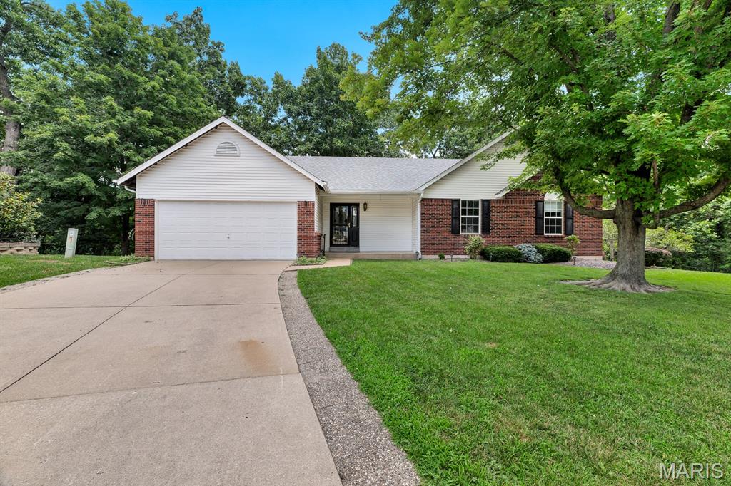 A rare one-owner ranch in O’Fallon with the space, setting, and floor plan buyers love. This open floor plan home offers 2,450 sq ft of finished living space, including a vaulted great room with gas fireplace, kitchen and dining area with easy flow, main-floor laundry with built-in cabinetry, 3 main-floor bedrooms, including a spacious primary suite with walk-in closet and updated vanity area with double sinks. The finished walk-out lower level adds a large rec room, full bath, natural light, and excellent unfinished storage/workshop space. Outside, enjoy a beautiful tree-lined lot, park-like backyard, Trex deck with awning, and a quiet cul-de-sac setting that feels tucked away while still being close to shopping, schools, and golf. Competitively priced for today’s market and lovingly maintained over the years, this home is a wonderful opportunity in a desirable O’Fallon location. Kitchen refrigerator, washer, and dryer can stay. Great layout, beautiful setting, and ready for its next chapter.
