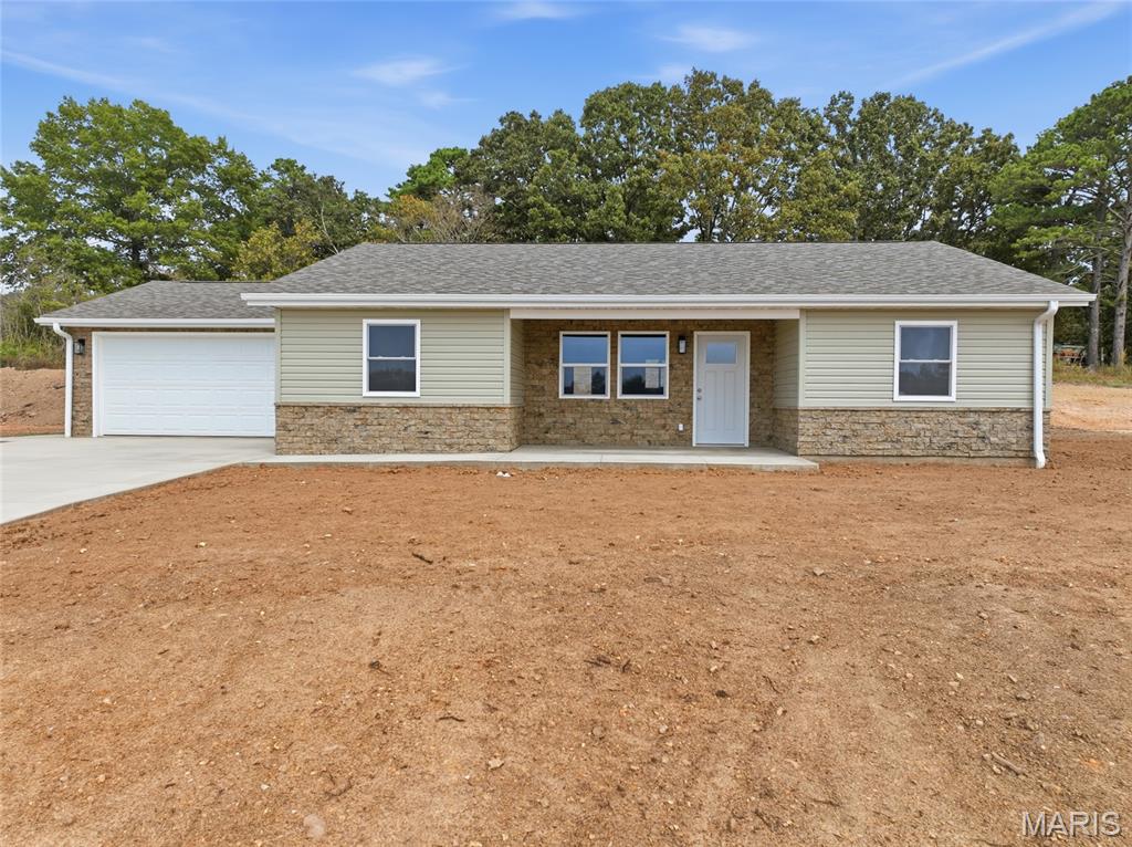 Welcome to Rawdon Tarn Subdivision, where small-town charm, modern comfort, and quality craftsmanship come together in this brand-new 3-bedroom, 2-bath home in Houston, Missouri. Designed and built by Houston’s premier homebuilder, AmickBuilt LLC, this beautiful new construction offers thoughtful finishes and a welcoming layout designed for today’s lifestyle. Step inside to a bright, inviting interior featuring durable waterproof luxury vinyl plank flooring and thermopane windows. The kitchen serves as the heart of the home with custom-built cabinetry and stainless steel appliances, creating a stylish and functional space for preparing meals, entertaining friends, or gathering around at the end of the day. Outside, a combination of mortarless stone veneer and vinyl siding creates attractive curb appeal with easy-care finishes.

Living in Rawdon Tarn offers something truly special. Subdivision owners enjoy shared ownership of a private pond, providing a peaceful setting where fish, geese, and other wildlife can often be spotted. It’s a beautiful backdrop for enjoying a slower pace of life while remaining just minutes from downtown Houston.

Conveniently located with access to Rolla and Fort Leonard Wood, this home offers the tranquility of a welcoming community without sacrificing everyday convenience. Additional features include a 50-gallon electric water heater and a one-year contractor’s warranty that transfers to the buyer at closing, providing added peace of mind.

Be the first to call this beautiful AmickBuilt home yours. Schedule your private showing today and experience new construction living in Rawdon Tarn!
