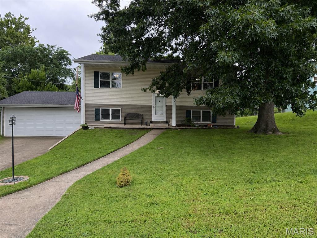 Spacious 5-bedroom, 2-bath split-foyer home located in The Forum subdivision in Rolla! This well-maintained home offers approximately 1,727 square feet of living space with a versatile floor plan featuring 2 bedrooms on the upper level and 3 additional bedrooms on the lower level. Enjoy a large living room, eat-in kitchen, luxury vinyl plank flooring, and a fully finished basement that provides additional living and entertaining space. The 2-car attached garage offers convenient parking and storage. Situated on a nicely sized lot with mature trees and a backyard setting, this property is conveniently located near parks, schools, and everyday amenities. Roof was replaced within the last year. Don't miss your opportunity to make this Rolla home your own!
