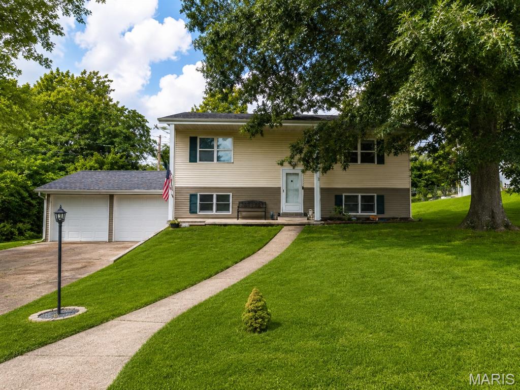 Spacious 5-bedroom, 2-bath split-foyer home located in The Forum subdivision in Rolla! This well-maintained home offers approximately 1,727 square feet of living space with a versatile floor plan featuring 2 bedrooms on the upper level and 3 additional bedrooms on the lower level. Enjoy a large living room, eat-in kitchen, luxury vinyl plank flooring, and a fully finished basement that provides additional living and entertaining space. The 2-car attached garage offers convenient parking and storage. Situated on a nicely sized lot with mature trees and a backyard setting, this property is conveniently located near parks, schools, and everyday amenities. Roof was replaced within the last year. Don't miss your opportunity to make this Rolla home your own!
