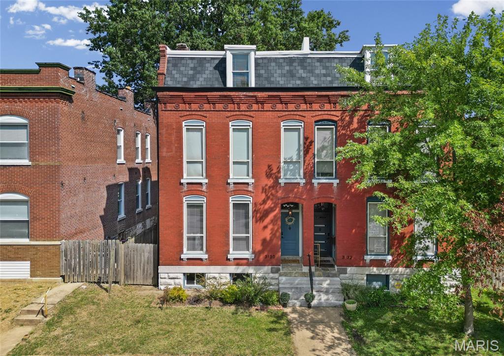 Open Sunday 1-3PM - What a beautiful place with 4 bedrooms & 3.5 baths to call HOME! Within walking distance to Cherokee St & close to Benton Park & Tower Grove South! This three-story brick beauty features two ensuite bedrooms, new roof 2025, privacy fenced-in outdoor, a garage AND historic charm with updates! As you enter, you'll be greeted by tall ceilings, exposed brick and beautiful hardwoods. Large living room connects the separate dining room. Huge kitchen with a center island, a pantry and LOTS of cabinetry. Main floor is rounded up by convenient half bath. Fall in love with the primary bedroom suite feat. a walk-in closets, private balcony & full bath w/ double vanity. Upstairs also offers a convenient washer & dryer and laundry space. A second ensuite bedroom with large sized full bath and spacious closet. Third floor offers an open loft space - great for an additional sitting room/ hobby area/ office/ gym or playroom.... endless options! Two additional bedrooms and a full bath complete the 3rd floor. Big backyard is an oasis – perfect for BBQ hangouts, gardening, pets+++ Detached, oversized two car garage for private parking. Move-in Ready - passed occupancy! Could also be a great short term rental / Airbnb. Enjoy urban living w/ quick highway access, right by shopping & other amenities. So close to some of the best restaurants in STL, bars, coffee shops, antique stores, parks the city has to offer! CALL NOW