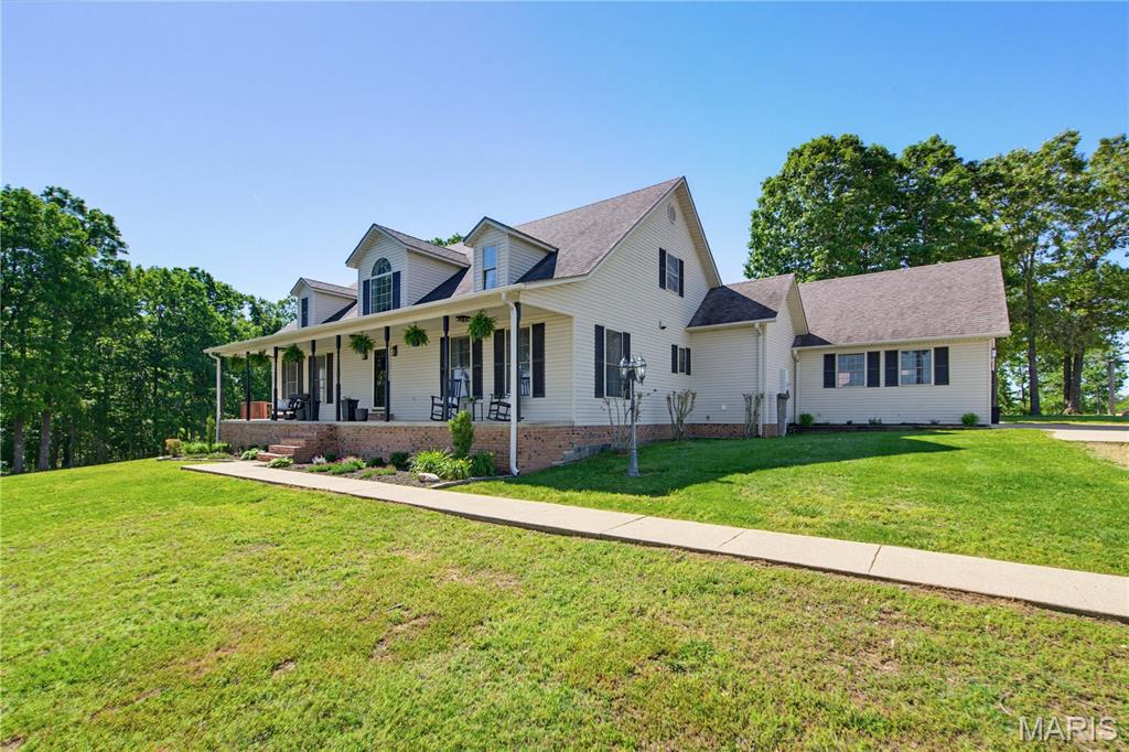 Nestled atop a scenic hillside and surrounded by 15 +/- surveyed acres, this stunning modernized home offers breath-taking views of rolling farmland and peaceful countryside.  Designed with both comfort and style in mind, this spacious home features 5 bedrooms and 5 bathrooms, with spacious walk-in closets and plenty of room for family, guests and entertaining.  Inside you will find a perfect blend of modern upgrades to include new flooring, new paint through the whole house, stove, dishwasher, light fixtures (both inside & outside), bathroom faucets, and a new hot water heater.  Enjoy low utility bills with the geothermal system.  This home features a large kitchen with granite countertops that creates an inviting atmosphere for any gathering.  Large swimming pool with surrounding deck is perfect for summer fun.  The 30x50 shop offers endless possibilities for hobbies, equipment storage and vehicles.  Don't wait, call today and schedule your showing!