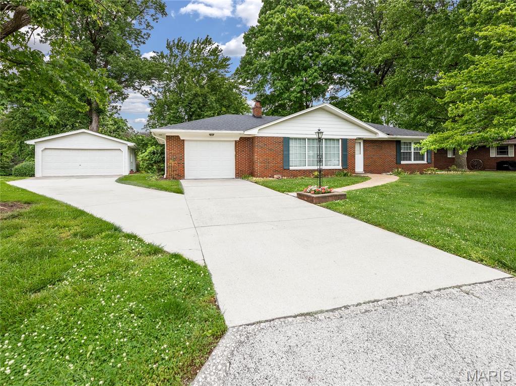 COMING SOON! WILL BEGIN SHOWING ON Friday, June 12. OPEN HOUSE JUNE 12TH (4:00 TO 6:00 pm)
Lakefront charm in desirable Collinsville location! Enjoy peaceful lake views from this well-maintained brick ranch situated on a beautifully landscaped lot just shy of 1/2 ACRE! The spacious living room features a large picture window letting in all the natural light, gorgeous hardwood floors, fireplace and flows seamlessly into the dining room with patio door leading to sunroom. Sunroom is a perfect spot to relax and enjoy the beautiful lake view! The kitchen offers plenty of space and retains its charming retro appeal. Two generously sized bedrooms one showcasing hardwood flooring. A classic, large hall bath serves the main level. The unfinished basement offers excellent storage and includes a finished 3/4 bathroom. Outside you will find stunning perennials, mature landscaping creating a truly special setting. Completing the property are a 1-CAR ATTACHED garage and an OVERSIZED 2-CAR DETACHED garage. Lots of room for extra parking too!