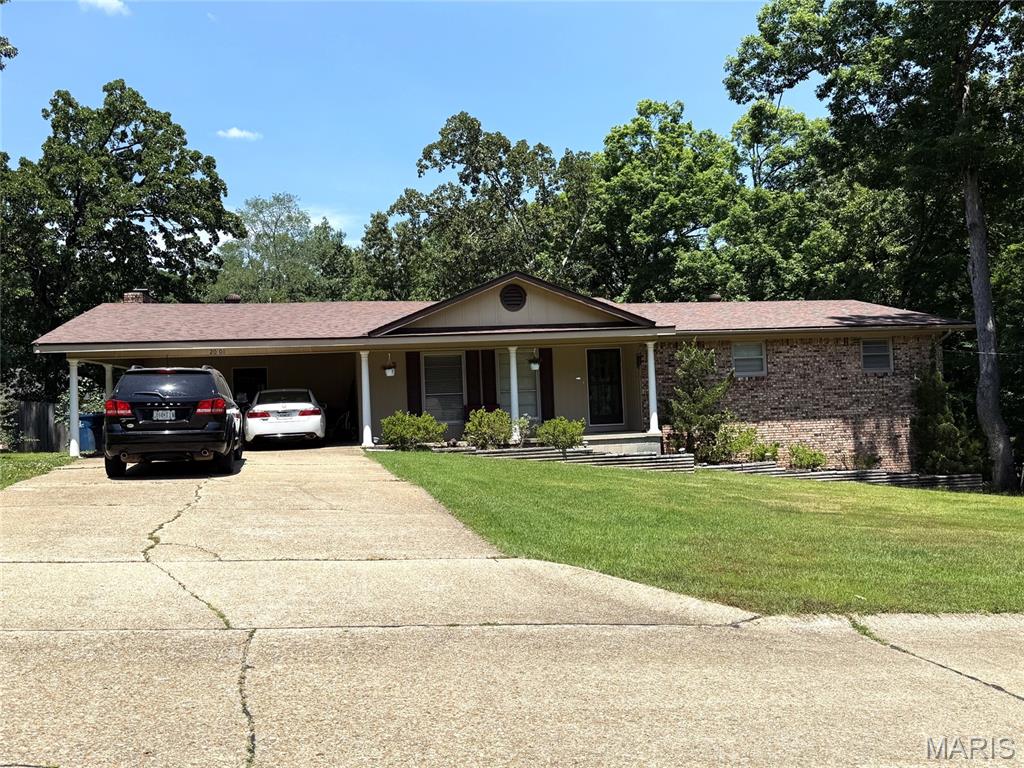 This spacious home offers over 3,000 square feet of total living space and a well-designed layout ideal for both everyday living and entertaining. The main level features 3 bedrooms and 2 full baths, a welcoming living room, and a separate dining area perfect for gatherings. The updated kitchen provides an abundance of cabinetry and workspace, making meal prep a breeze.

A large family room with a cozy fireplace serves as the heart of the home, while the well-appointed laundry room includes ample cabinets for storage and organization. Just off the main living area, the sun porch offers a bright and relaxing space to enjoy morning coffee or unwind at the end of the day.

The basement adds excellent versatility with a den area, a full bath, and a generous storage room. A walk-out door leads directly to the backyard, making this space ideal for hobbies and a small workshop for all your projects. This home combines space, functionality, and comfort—ready to fit a variety of lifestyles.