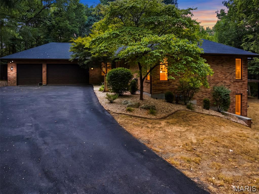 Exceptional finishes and thoughtful design define this stunning 5,900-square-foot retreat on 1.3 private, wooded acres in Waterloo's prestigious Sterritts Run Subdivision. Completely remodeled top to bottom, this 6-bedroom, 5-bath home offers refined living inside and resort-style entertaining outside. New LVP and ceramic tile flow throughout, and the redesigned kitchen showcases painted cabinetry, quartz countertops, a tile backsplash, and black stainless appliances. The primary suite is a true escape, featuring two walk-in closets, a brand-new spa bath with a jetted tub, tile walk-in shower, double vanity, and private deck access. The walkout lower level adds two more bedrooms, a full bath, wet bar, rec room, and office, ideal for multigenerational living or entertaining. Enjoy dual HVAC, a whole-home water softener, main-floor laundry, and a newer roof. Outside, unwind by the 24x18 inground pool, fully updated with a new pump, filter, and retractable cover, plus a cleaning robot included. A 3-car attached garage completes this exceptional Waterloo estate. Too many updates and unique features to mention. You have to come see it for yourself!