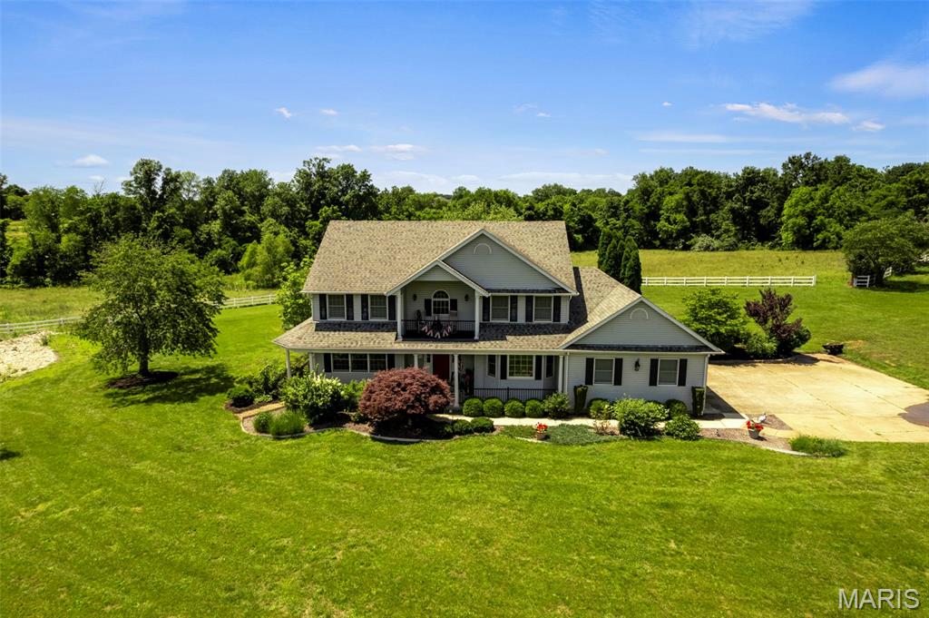 Rare opportunity to own a beautiful waterfront property on approximately 11 acres in Quail Run Estates, just outside Farmington. Offering 5 bedrooms, 4.5 bathrooms, and over 4,000 finished square feet, this home provides the space, privacy, and amenities that are increasingly difficult to find in today’s market.

The main level features spacious living areas, an updated kitchen with granite countertops and center island, and large windows that showcase the property’s scenic surroundings. Multiple gathering spaces make the home ideal for both everyday living and entertaining.

The primary suite is a true retreat, featuring a fireplace, spacious ensuite bath, walk-in closet, and private balcony overlooking the lake. Upstairs and lower-level living spaces provide flexibility for family, guests, home offices, or recreation.

The finished walkout basement offers additional living space and direct access to the backyard and pool area. Outside, enjoy a large rear deck, covered wraparound porch, in-ground pool, mature landscaping, and beautiful views of the water from multiple vantage points throughout the property. A large portion of the acreage is fenced, providing additional versatility for horses, recreation, or simply enjoying the open space.

Whether you’re relaxing poolside, enjoying coffee on the porch, or watching the sunset over the lake from the private balcony, this property offers the peaceful country setting you’ve been looking for while remaining just minutes from Farmington’s shopping, dining, schools, and healthcare facilities.

Properties with this combination of acreage, water frontage, pool, fenced pasture, and finished living space rarely become available. Schedule your private showing today.