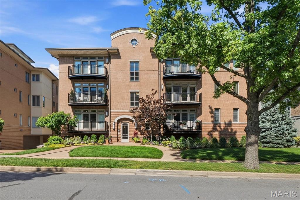 Beautifully renovated 2-bedroom, 2.5 bath first floor condo in the heart of Clayton. Completely renovated with handsome designer finishes featuring rich greens, warm gold accents, and timeless details throughout. Step from the welcoming foyer into a spacious light drenched family room and large dining area, creating a cohesive layout for everyday living. A gorgeous oversized eat-in kitchen is the center of the home and offers tons of space for storage and entertaining with a convenient half bath just across the hall. The well appointed primary opens to a private balcony and the spacious bath features a wet room and double vanities. The inviting floor plan includes in-unit laundry, two private balconies, and two dedicated parking spaces.  This gorgeous unit is ideally located near Clayton's restaurants, shops, parks, and business district.