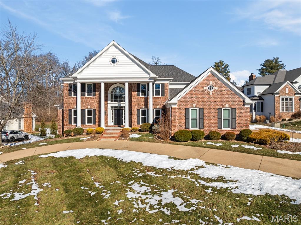 Welcome to 14342 Manderleigh Woods Drive — a beautifully crafted all-brick colonial estate tucked away in one of the most desirable enclaves in Town & Country. This original-owner home blends timeless architecture with modern comfort, set on a spacious, tree-lined lot that delivers exceptional privacy.
Inside, you’ll find over 6,150 square feet of impeccably maintained living space designed for both everyday living and effortless entertaining. The expansive updated kitchen serves as the heart of the home, showcasing premium cabinetry, hardwood floors, marble countertops, a walk-in pantry, and Viking Professional appliances — all opening seamlessly to the dining and hearth rooms with vaulted ceilings, plantation shutters, and a gas fireplace.
The main-level primary suite offers a true private retreat with two walk-in closets, double vanity, jetted tub, separate shower, and private water closet. Upstairs includes a large ensuite bedroom with private bath and oversized walk-in closet, plus two additional bedrooms with walk-in closets and private vanities sharing a Jack-and-Jill style bath.
The finished walk-out lower level adds over 1,400 square feet of living space with floor-to-ceiling windows, full bath, gas fireplace, and a well-appointed wet bar with full refrigerator — ideal for entertaining, game days, or movie nights.
Outdoor living is just as impressive, with three patios, a quiet cul-de-sac setting, and wooded common ground behind the home providing a peaceful natural backdrop.
Major recent updates (within the past five years) include a new roof, gutters and downspouts, windows, water heater, and three HVAC systems — offering confidence and low-maintenance ownership for years to come.
Located in Manderleigh of Town & Country, just minutes from Hwy 141 and I-64, this home combines luxury, privacy, and accessibility near top schools, hospitals, shopping, and dining.