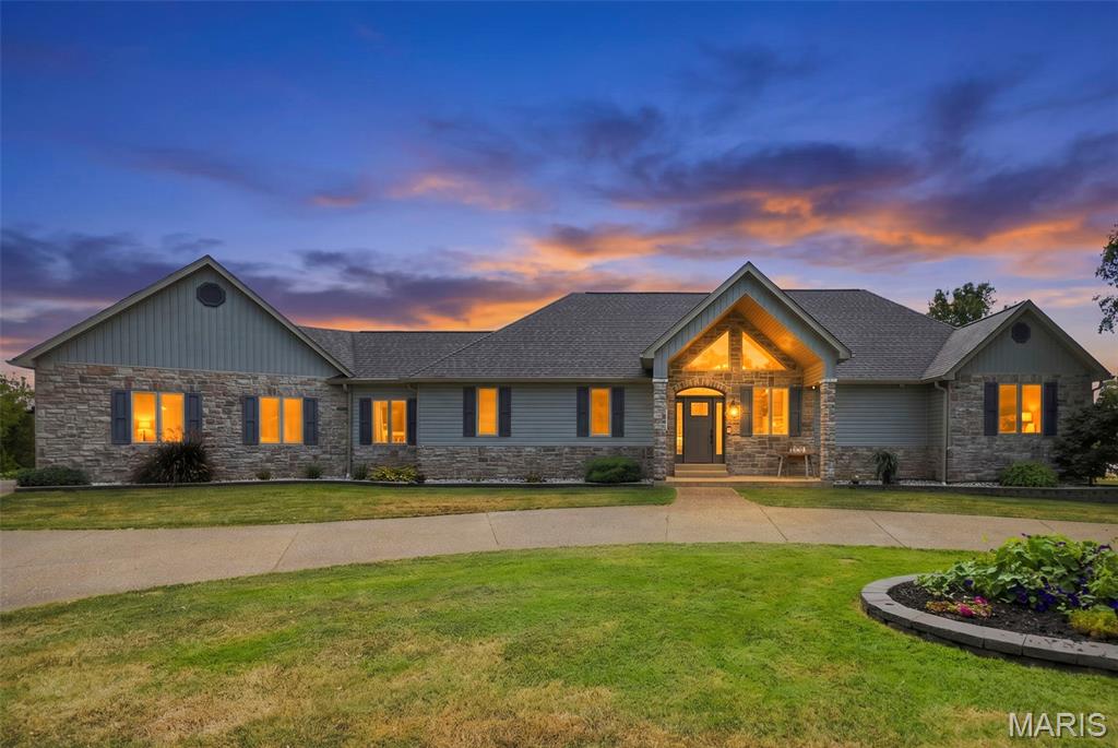 Amazing waterfront views. 3 level acres. Fully remodeled inside and out. This gorgeous custom-built ranch home sits at the end of a quiet, paved cul-de-sac in Pine Crest Estates touting a circle drive, 4 large bedrooms, 3 bathrooms, a gourmet kitchen, wide-open living space with vaulted ceilings, exposed wooden beams, a bonus loft and stunning 9 foot pour walkout basement all with picturesque views of your shared private lake. Kitchen fully remodeled in 2020, new appliances, cabinets with soft close feature, storage organizers, pan organizers on rollers, and appliance garage. Primary bathroom featuring huge shower with rain shower head and 6 steam/pressure spouts.  High efficiency hot water heater with added water softener.  From the quaint covered outdoor breakfast nook/deck to the entertainer’s basement with a full bar and large patio, you get the best of both worlds. There’s plenty of space to host your family and friends and all of the quiet serenity your family could hope for. Roof, siding, High Efficiency HVAC, deck, and exterior stairs all replaced in 2024. Lake access has tide wall with walkway and sand boat launch for easy kayaking. Come see all of the modern finishes, updates and of course, the can’t-miss views. Live like you’re on a resort all day, every day!