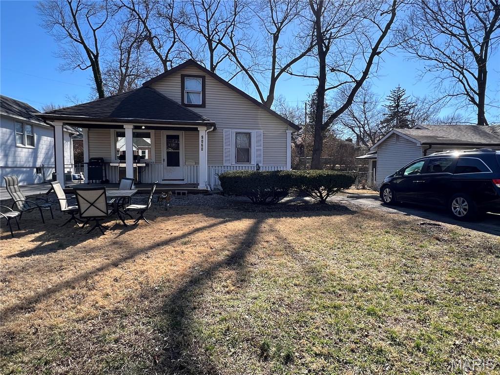A well-maintained house located on a quiet street.   The house feature a coved front porch.  Beautiful flooring through out.  A large bedroom in the main floor.  There is a recreation area and a second bedroom.  The laundry room on the main floor.  The property to sold "as-is".