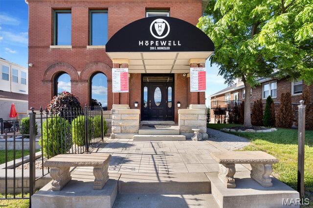 This is an outstanding opportunity and priced to sell! Rich in character and history, this classic downtown building was built in 1880 and offers approximately 5,902 square feet of versatile space ready for your vision. Located in the heart of Downtown Warrenton, just steps from the area's growing nightlife, restaurants, and shops, this property offers exceptional visibility and potential. Formerly home to local favorites Hopewell Winery, Blue Anchor Bistro and Brewskies, the property features a large outdoor patio, creating additional dining and entertainment space for customers. For entrepreneurs looking to enter or expand in the restaurant industry, the furniture, fixtures, and equipment can remain, making for an easy and cost-effective transition. The seller has made many recent upgrades including commercial kitchen updates, new flooring, new paint, bar coolers, lighting, 2 mini-splits for kitchen, refurbished hardwood flooring and much  more!   In addition to the commercial space, the property includes three apartments: a spacious 3-bedroom, 2-bath apartment on the upper level, an upper-level studio apartment, and a lower-level studio apartment, providing excellent income-producing opportunities. Additional features include a newer AC unit installed in July 2022.  Location: Prime Downtown Warrenton location with high traffic exposure between St. Louis and Columbia, Missouri, conveniently located just off Interstate 70. Please do not disturb tenants.