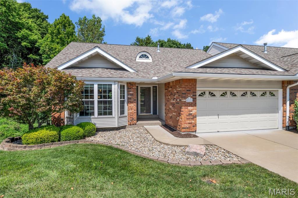 Exceptional end-unit villa offering more than 2,500 square feet of beautifully finished living space on arguably one of the best lots in the community. Backing to a peaceful tree line, this meticulously maintained home combines remarkable privacy, a walkout lower level and effortless villa living. The welcoming foyer includes a coat closet and powder room. Recently updated with exceptional craftsmanship, the stunning kitchen features a sizable island with seating, granite countertops, crown-topped softclose cabinetry, a walk-in pantry and adjoining breakfast room. A generous formal dining room with bay window opens to the vaulted great room, where a wall of windows frames the wooded view. Built-in shelving and a gas fireplace add warmth and character, while doors open to an expansive covered deck overlooking the private tree line. The main-floor primary suite features a tray ceiling, bay window, walk-in closet and secondary closet. Its beautifully renovated bath offers a separate tub and shower, expansive double vanity with gorgeous granite top, and linen closet. A large main-floor laundry room and attached two-car garage complete the main level. The finished walkout lower level is ideal for guests and entertaining, featuring a second living room with gas fireplace and patio access, second bedroom, full bath, wet bar, workshop, and home office or craft room. Enjoy an incredible Chesterfield location just minutes from Highway 64/40 and Clarkson Road, with convenient access to shopping, restaurants, parks, medical facilities and major commuting routes. Groundskeeping, snow removal, and mowing are all included!