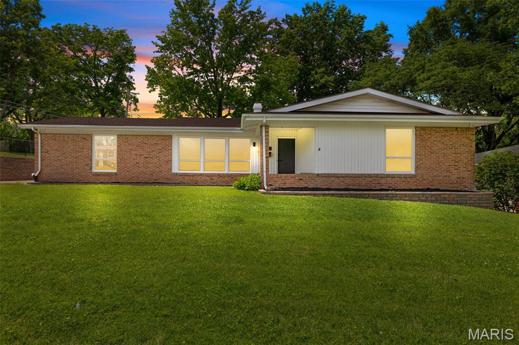 Beautifully renovated 4-bedroom, 2-bath ranch home in the heart of Florissant featuring approximately 1,675 sq ft of living space. This spacious home offers a functional floor plan with large living areas, a cozy fireplace, new flooring throughout the entire home. It's rare to find such a large home with 4 spacious bedrooms on the main level! The kitchen includes new cabinets, custom tile backsplash finishes and plenty of cabinet space. The primary batheroom has custom tile and new vanities and fixture!. Enjoy outdoor living with a patio, large backyard, and attached rear-entry garage. Conveniently located near parks, schools, shopping, and dining with easy access to major highways.