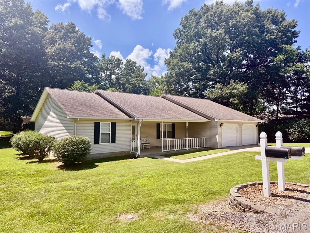 Very well-maintained 3-bedroom, 1¾-bath all-electric home on a large corner lot! The kitchen features abundant counter space, a pantry, and a snack bar with room for several barstools. All appliances stay.  The insulated garage and separate tool shed provide plenty of storage and workspace. Enjoy both a covered front porch and covered back porch for relaxing outdoors. The property extends beyond the rock-lined drainage ditch, offering additional yard space.  A clean, move-in-ready home with practical features and plenty of room inside and out!