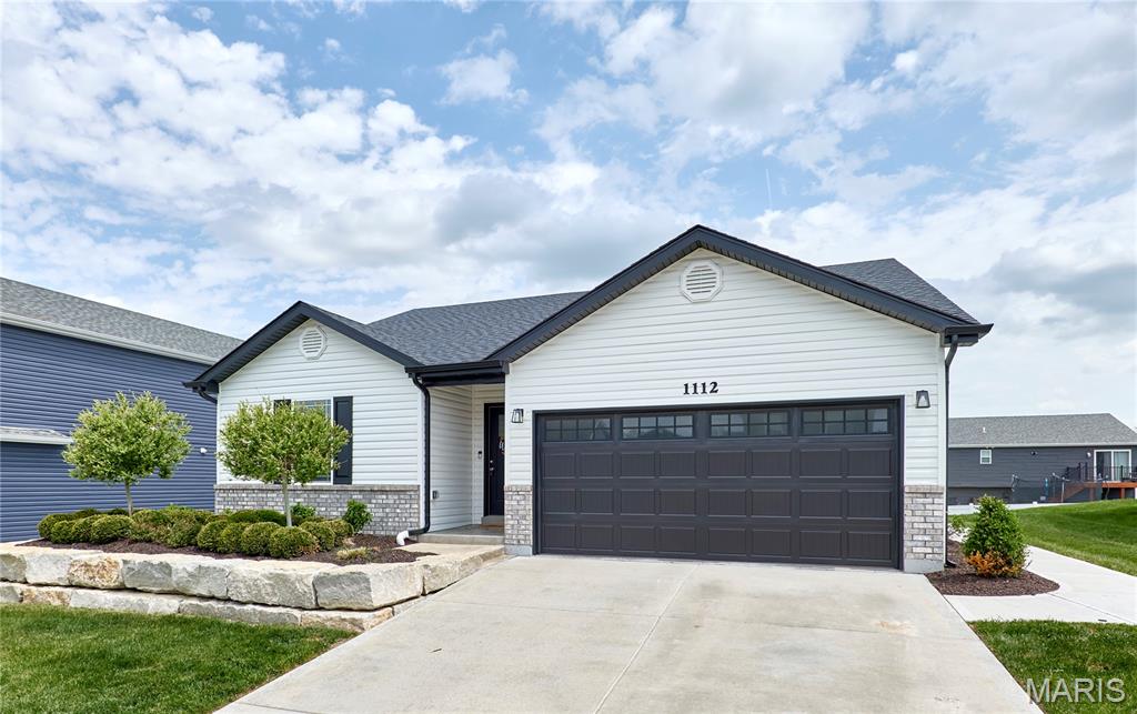 This 3 year NEW 3Bed/2Bath Ranch has every upgrade you could imagine! They include vaulted ceilings, rounded corners, quartz countertops, backsplash, stainless steel appliances, 42" cabinets with "soft close", custom neutral-colored paint job throughout, framed windows, taller baseboards, adult-sized cabinets in bathrooms with marble countertops, walk-in closet, upgraded carriage doors on 2-car garage with opener, panel doors, and upgraded water/light fixtures throughout the house! MAIN FLOOR master and laundry! The Master bath features a luxury whirlpool tub and separate shower. Exterior features include professional landscaping (front yard & back!), irrigation system, concrete steps/patio/walkway from garage to back, and fully fenced (black aluminum) backyard!