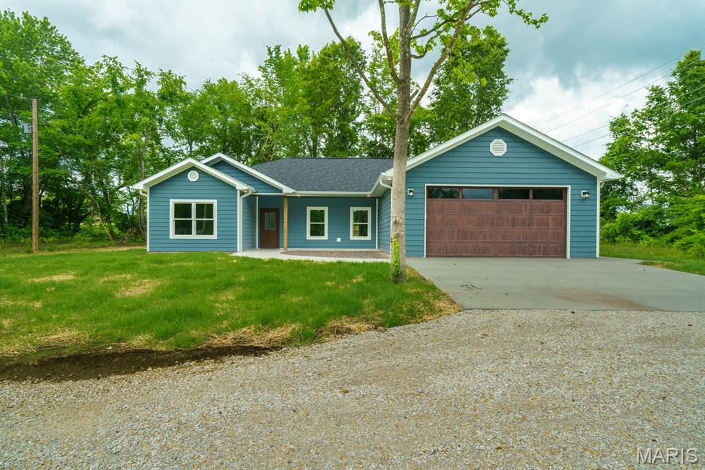 Don’t miss this opportunity to own a brand-new 3-bedroom, 2-bath home! The open floor plan features high ceilings in the common areas, creating a spacious and inviting feel. The primary bedroom is split from the other two bedrooms, offering additional privacy. Enjoy the covered back porch overlooking a wooded area that enhances the sense of seclusion. Located in a peaceful neighborhood in St. James, this home provides convenient access to local schools, parks, and amenities.
