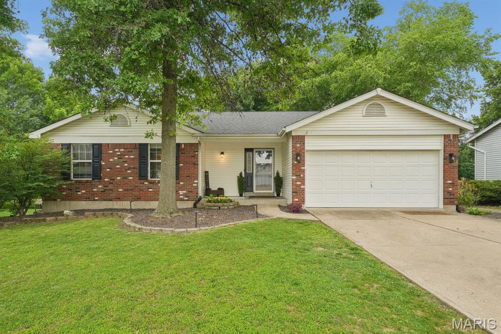 Sitting on a peaceful cul-de-sac, this super cute ranch just may be your next home-sweet-home! A covered front porch leads into a spacious and welcoming open floor plan. The great room has sky-high vaulted ceilings and a cozy wood-burning fireplace—it's the perfect place to relax at the end of the day. It leads into the dining room and the bright and open kitchen, which offers plenty of counter and cabinet space, sleek stainless appliances, and a pantry. Outside, head to the patio for al fresco dining and a level, fenced-in backyard where you’ll want to spend the whole summer! The primary bedroom suite has an updated full bath with shower. Two additional bedrooms share the updated hall bath. Laundry day is less of a chore with a convenient main floor laundry room. Downstairs, there’s more living space with a media room ready for movie night, and the rest of the lower level gives you room to grow—with framing and a rough-in to give you a head start finishing it to suit your needs. A two-car garage is the icing on top!