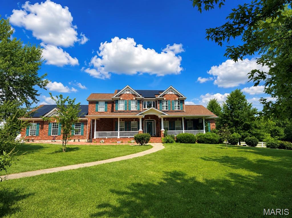 **Mechlin Farm** is a truly exceptional equestrian estate situated on approximately 23 scenic, rolling acres in an incredible Wright City location, with city limits bordering the property. Designed for serious equestrian use, this one-of-a-kind property offers more than 36 horse stalls, multiple fenced turnouts, six lush pastures with room for additional pastures, an outdoor riding arena and a massive heated and insulated indoor arena.
The extensive equestrian facilities include a 23-stall barn with an approximately 172'x79' +/-; climate controlled indoor riding arena, 4 indoor and 3 outdoor wash stalls, tack room, office, viewing room with kitchenette, and hay storage. Additional improvements include a 5-stall barn, a 13-stall barn with concrete flooring, wash stall and tack room, plus multiple outbuildings and storage areas.
A heated and insulated 72' x 54' shop features multiple overhead doors, including two approximately 14 feet high, and is currently partially leased, providing additional income to the owners. The property’s extensive storage, workshop space and accessibility also make it an excellent option for small contractors, equipment storage or a home-based business.
The charming, custom-built, mostly brick 1.5-story main residence offers approximately 5,654 square feet of finished living space with five bedrooms, four full bathrooms and one half bathroom. Highlights include a main-floor primary suite, walkout lower level, oversized three-car garage, solar panels and a new furnace installed in 2025.
A second residence, while in need of some updating and TLC, offers excellent potential for caretaker’s quarters, extended family, guest accommodations or additional rental income.
This remarkable property is ideally suited for a large equine operation, boarding or training facility, private equestrian estate or income-producing investment. The listing includes two parcels: Tax ID 04-20.0-0-00-012.000.000 and Tax ID 04-20.0-0-00-012.157.000.
**Priced to sell well below its potential value—do not wait to schedule your private showing. A property with this combination of acreage, residences, equestrian facilities and income potential will not last long!**   Property is being sold in "AS IS" Condition, seller will make no repairs, inspections are for informational purposes only.
**Gazebo does not stay & buyer to take over solar panel payments**