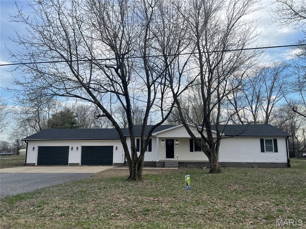 Beautifully remodeled home sitting on a corner lot with almost 1 acre of land in East Prairie School District. Updated with new roof, HVAC, paint and so much more! Open concept floor plan allows for plenty of space for all your entertaining needs. The kitchen has a large island, new appliances and new cabinets with soft close drawers. The 3 large bedrooms offer walk-in closets, new light fixtures and flooring. The large laundry room gives you plenty of space for additional storage needs. Off the kitchen you will find a large deck with plenty of room for your grill and outdoor furniture. This home offers a large partially fenced yard, giving the family plenty of privacy while enjoy outdoor activities. If outside storage space is what you're looking for this home has it... It offers an oversized 2 car garage plus a 24x34 shop with concrete floors and electric. Don't wait, call today to schedule a private viewing of this move-in ready home!