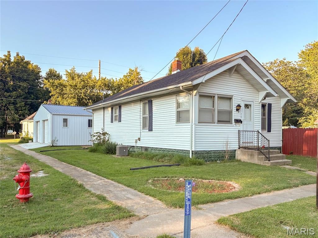 Check out this charming home on a corner lot, fenced in back yard, and an inground pool for relaxing on those hot summer evenings. The owner has devoted a considerable amount of time for improvements, which include a new roof in 2023, remodeled  bath, newer flooring and extensive work on the detached garage.  This 2 bed, 1 bath home maintains much of the original charm but with modern day conveniences.  The living room is spacious enough for social gatherings but still maintains a cozy feeling. The pool has a new pump, cover, and storage shed for supplies.  An eat-in kitchen provides a comfortable dining area for intimate dinners or for family and friends. A complete remodel of the bathroom adds convenience and charm.  The laundry room is tucked away in the walk-in closet in the primary bedroom.  A full, unfinished basement is a haven for storage and possibly a workshop area.  An extremely spacious detached garage (app. 1,216 s/f) will accommodate two vehicles; has a mini split for heating and AC; roughed in plumbing for a bath, is drywalled, and still provides ample room for equipment storage and a workshop.  Contact your favorite realtor to schedule a viewing.
