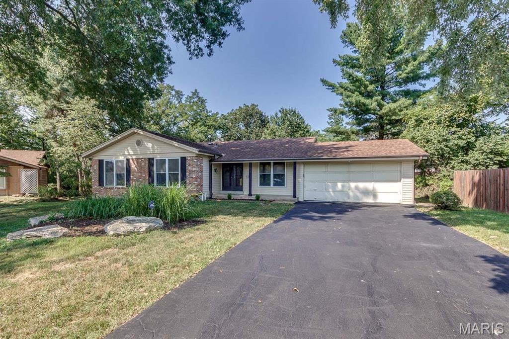 This spacious well maintained 3-bedroom, 3 baths ranch home over 2300 sq ft of living space on two levels. Set on a private cul-de-sac. Vinyl siding, enclosed soffits/facia and insulated windows provide easy care maintenance.  The center hall entry opens to the formal living and dining rooms featuring crown molding. Hardwood floors span the first floor. A wood burning fireplace with a raised 10 ft hearth accent the family room that opens to 18x14 deck is perfect to relax and entertain. The updated kitchen has 42-inch wood cabinets, wood floors, pantry, electric cooktop, wall oven and a convenient stackable washer & dryer closet. The master bedroom has a full bath and a 7ft walk-in closet. Two other bedrooms and a remodeled hall bath complete this floor. A huge rec room with ceramic tile floors and 2 additional flex rooms round out the lower level. Enjoy the subdivision pool and tennis court. Minutes to Hwy 141 and major shopping centers. Parkway schools. Landlord prefers credit score of 700 or above with an income of three times the rent. One small or medium pet is allowed with $250 nonrefundable pet fee.