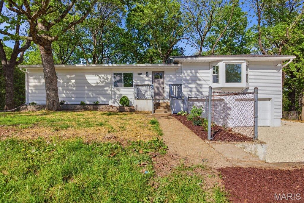 This is the kind of remodel buyers wait for! Step inside and feel the difference immediately with new flooring, fresh paint, updated lighting, and a fully modern finish throughout. Every detail was chosen to create that move-in ready confidence the moment you walk through the door. The kitchen is the true centerpiece of the home. Designed for both style and function, it features new quartz countertops, sleek cabinetry, and stainless-steel appliances. It is an open and inviting space that is built for everyday living or entertaining guests. Both bathrooms have been beautifully renovated with a fresh upscale look that adds a touch of luxury. Big ticket peace of mind matters, and this home delivers with a brand new septic system already in place. Out back, the wooded yard offers privacy, natural views, and peace. There is a spacious back porch that would be perfect for morning coffee, evening bonfires, or bringing your own vision to create an incredible outdoor space! The walk out basement provides endless possibilities. Home gym, office, studio, or future finished living space. This is where value and opportunity meet.You get the peace of nature with the polish of a full renovation in one smart package. Schedule your showing today and come experience it for yourself.