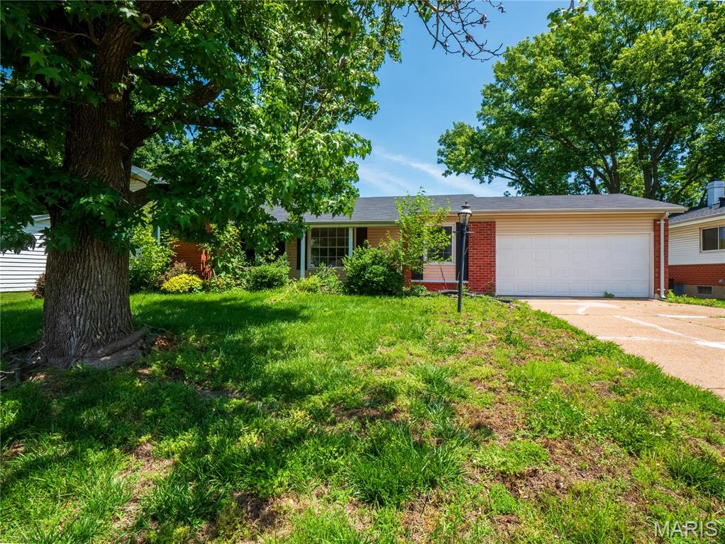 Affordable and move-in ready 3BR/2BA brick ranch with premium updates throughout! Step inside to gorgeous hardwood floors and a bright, open living space. The fully modernized kitchen boasts sleek cabinetry and stainless steel appliances. Relax in the spacious primary suite featuring a private en-suite bathroom.The partially finished lower level provides excellent flex space for a variety of uses and a potential 4th bedroom. Enjoy complete peace of mind with recently updated mechanical systems. Unwind on the charming screened-in porch overlooking a massive, fully fenced backyard—perfect for pets, play, and entertaining.