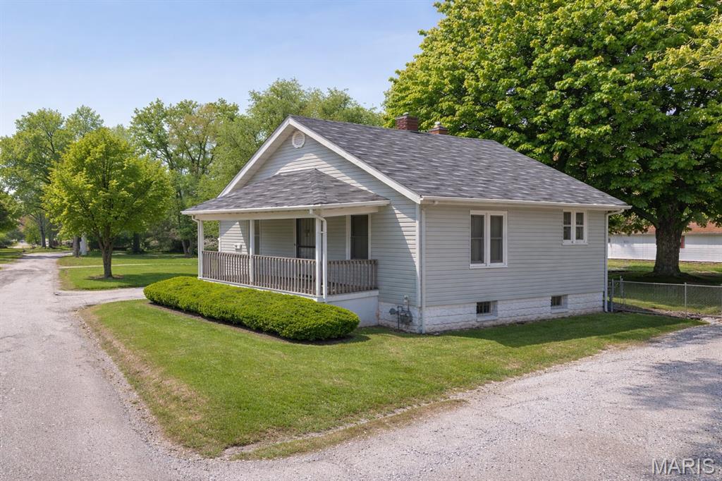 Cute 2-bedroom ranch home with a full basement, located on a quiet street and situated on two land lots for added space and privacy. This property presents a strong opportunity for investors or buyers looking for their next project. The property is being offered as a cash sale only, with no contingencies accepted, and is sold strictly as-is, where-is. No interior showings will be permitted, no additional interior photos are available, and interior access for inspections will not be granted. No survey or keys will be provided. All listing information is deemed reliable but not guaranteed, and buyers are responsible for completing their own due diligence prior to submitting an offer. Buyers must independently verify all property details, including but not limited to the number of bedrooms and bathrooms, square footage, room sizes, lot dimensions, and any other relevant information. Photos and marketing remarks are provided for reference purposes only. By submitting an offer, the buyer acknowledges they have independently investigated the property and are making their purchase decision based solely on their own findings. Buyer or buyer's agent to verify all mls info