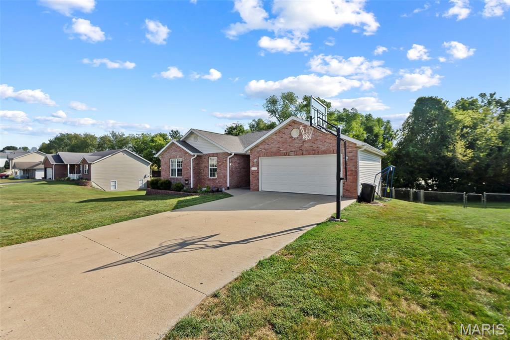 Professional photos are being taken Saturday, 9/19. This 3-bedroom, 3-bath ranch-style home offers a spacious and versatile layout with a brick and vinyl exterior. The walk-out basement provides additional living space with a den and separate office, offering plenty of flexibility for work, hobbies, or entertaining. Outside, the fenced-in yard provides a great space to enjoy the outdoors, while the enclosed area beneath the deck offers additional space. A two-car garage provides convenient parking and storage, and a safe room located beneath the garage offers an excellent space for storm protection and additional storage. With its ranch-style layout, walk-out basement, fenced yard, garage, and versatile lower-level spaces, this home offers plenty to appreciate in Jackson.